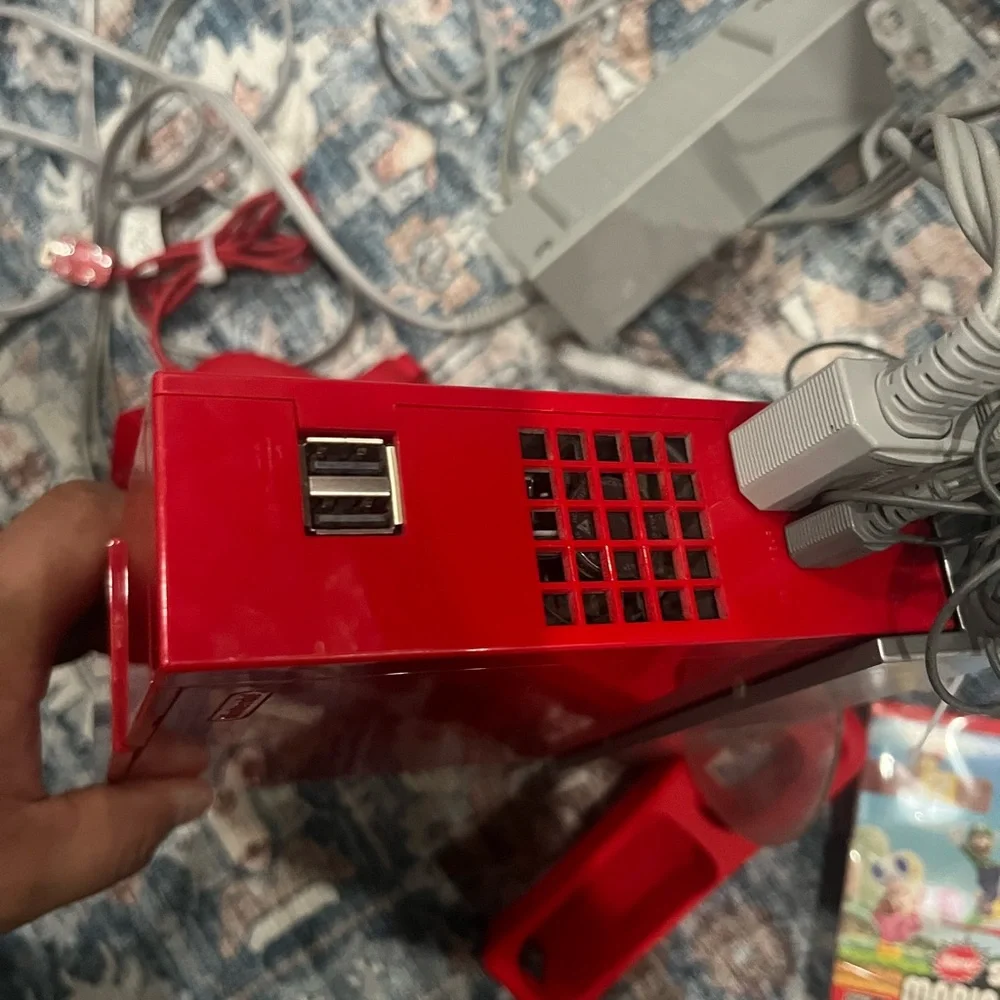 Nintendo Wii in Vibrant Red with Accessories controller. Some times. Works.